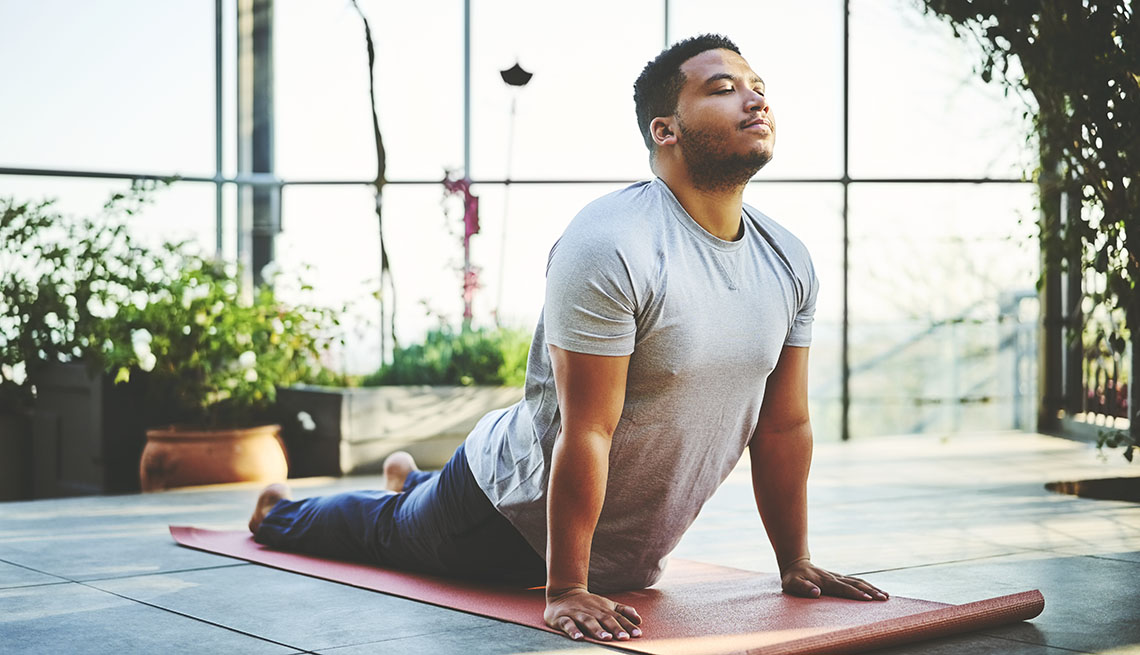 adult man practicing yoga